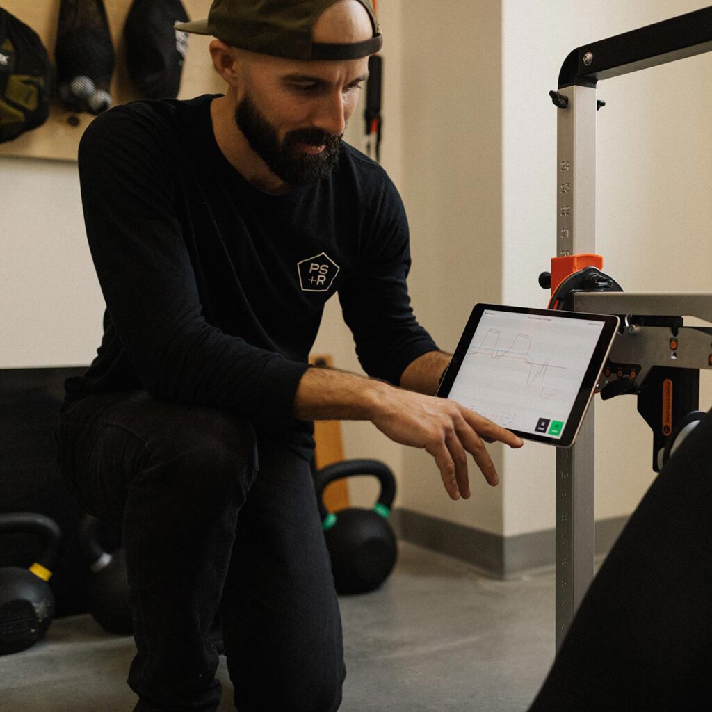 Steve Fell showing athlete information on the iPad